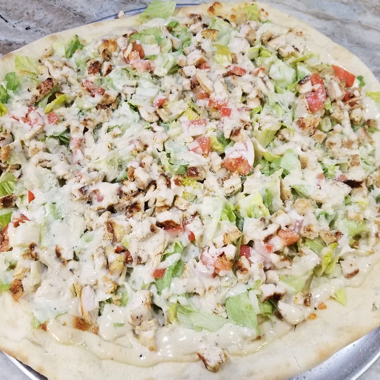 Fresh Caesar Salad and More at Our Pizzeria
